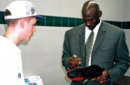 Jordan signs the Nike Air Jordans that he wore through the NBA Finals